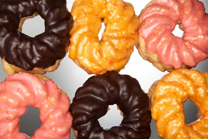 Six donuts with icing in two rows