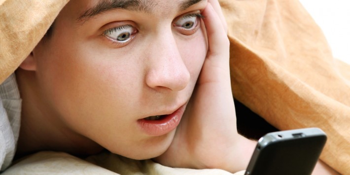 Surprised Teenager with Cellphone